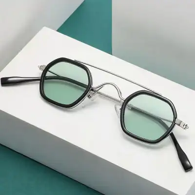 Stylish vintage sunglasses with green-tinted lenses and black frame, perfect for UV protection and fashion statement in summer or casual outings.