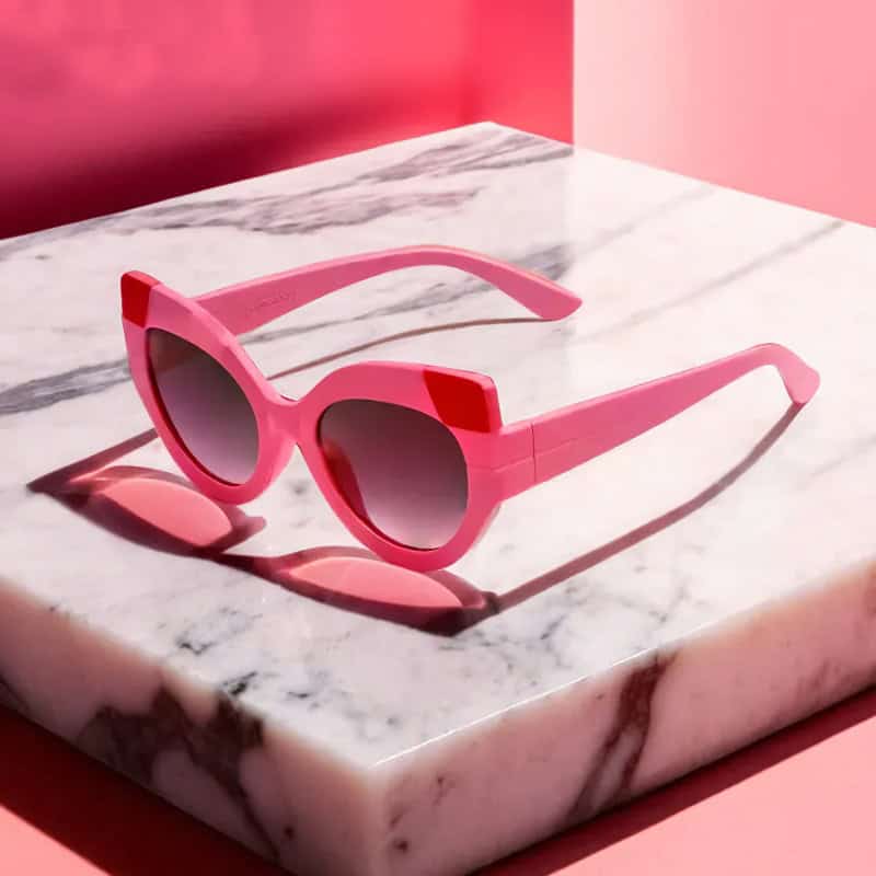 Fashionable pink sunglasses for women, stylish eyewear accessory, UV protection, trendy sunglasses for summer, eye health, and fashion statement.