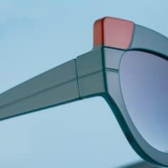Close-up of modern blue sunglasses with tinted lenses and sleek frame design, perfect for eye protection and stylish fashion accessory.