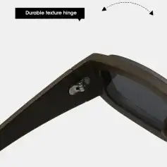 A close-up of black sunglasses showcasing a durable textured hinge with a sturdy design, emphasizing style and longevity, perfect for those seeking fashionable and durable eye protection.