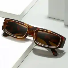 Stylish tortoiseshell sunglasses with rectangular dark lenses for UV protection, ideal for both men and women seeking fashionable eyewear accessories.