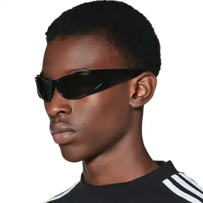 Stylish futuristic black sunglasses ideal for modern fashion and eye protection, perfect for indoor and outdoor wear.