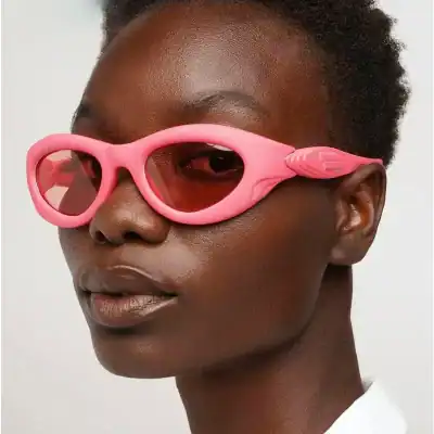 Pink protective goggles for kids with safety features, ideal for swimming, outdoor activities, or eye safety. Durable plastic frames with tinted lenses for UV protection.