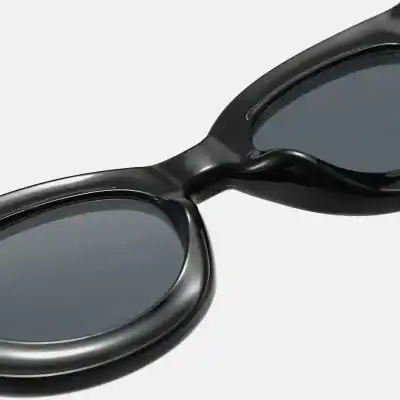 Black sunglasses with tinted lenses, fashionable and protective eye gear. Perfect for outdoor activities and adding a trendy touch to your look.