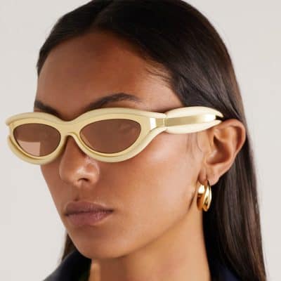 Fashionable cream-colored sunglasses with tinted lenses, perfect for stylish sun protection and making a bold fashion statement.