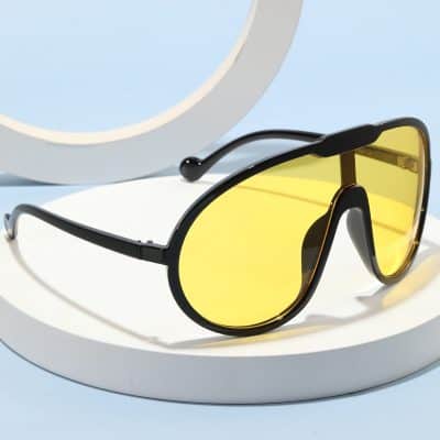 Stylish sunglasses with yellow tinted lenses, perfect for sun protection and fashion. Explore the Monalisa Store for premium eyewear options and accessories.