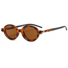 Sunglasses with round tortoise shell frames and brown lenses, stylish eyewear for sun protection and fashion. Perfect for casual or trendy outfits, enhancing your look effortlessly.