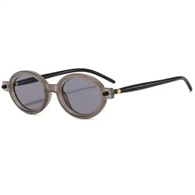 Stylish round sunglasses with a transparent beige frame and black temples, providing UV protection and perfect for fashion-forward look. Ideal for sunny days and outdoor activities.