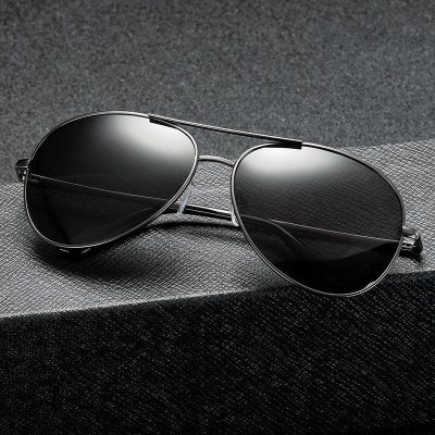 Stylish black aviator sunglasses with dark lenses and metal frame, perfect for UV protection and fashion. Ideal for men and women seeking quality eyewear.