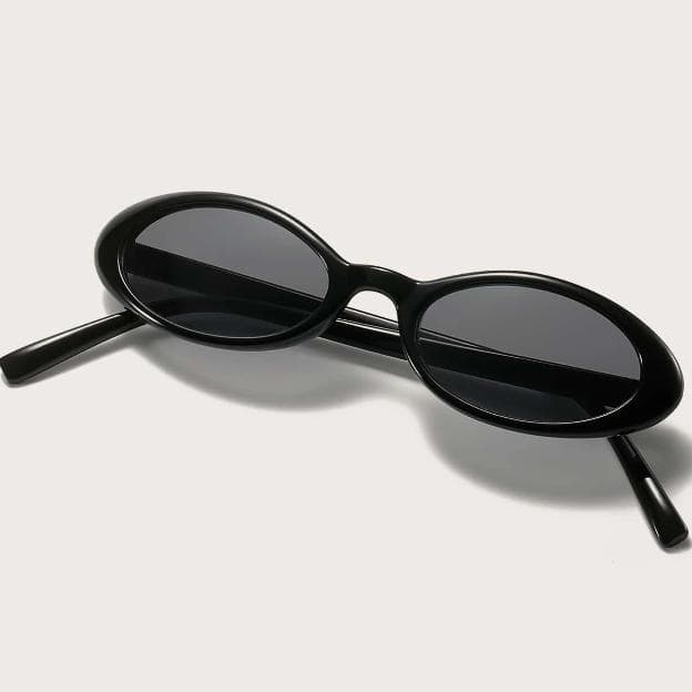 Stylish black oval sunglasses with tinted lenses, perfect for fashion and eye protection. Ideal for sunwear and enhancing your look.