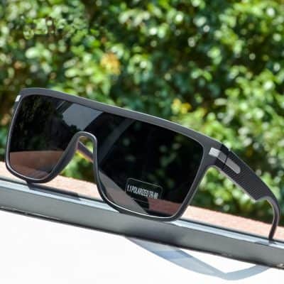Sleek black polarized sports sunglasses designed for outdoor activities, offering UV protection and enhanced vision clarity. Perfect for active lifestyles and outdoor sports enthusiasts.