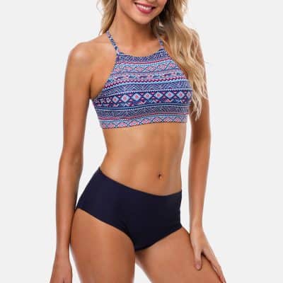 Vibrant tribal print bikini top paired with high-waisted black shorts, perfect for beach or poolside fashion. Shop stylish swimwear for women at Monalisa Store.