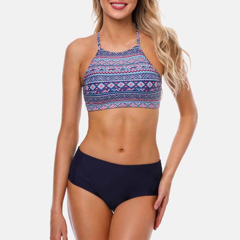 High-quality stylish bikini set for women, featuring a colorful patterned halter top and black bottoms, perfect for beach or pool lounging.