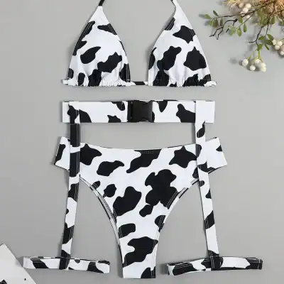 Cow print bikini swimsuit with adjustable straps, hook belt, and high-leg design for trendy swimwear style and comfort at the beach or pool.