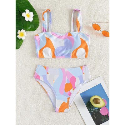 Vibrant, trendy bikini swimsuit with bold abstract patterns perfect for beach or pool days, available at Monalisa Store.