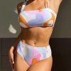 Stylish colorful swimsuit with tummy control and body shaping features, perfect for sunbathing or beach wear, enhancing confidence and style.