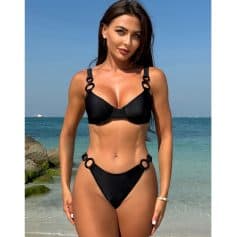 High-quality black swimsuit with fashionable ring details, perfect for summer and beach wear.