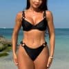 Versatile black bikini for women, stylish and comfortable swimwear perfect for beach and pool days, featuring eye-catching ring details for a modern look.