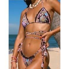 Colorful floral bikini top and bottom, stylish and trendy swimwear perfect for summer beach days.