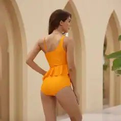 High-quality women's swimwear in vibrant orange with ruffle accents, perfect for beach, pool, or resort vacations. Comfortable fit and stylish design for all-day wear.