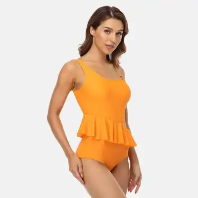 Vibrant orange women's swimsuit with ruffle detail, perfect for beach or poolside. Made for comfort and style, ideal for summer swimwear collections.