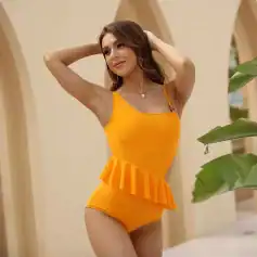 Stylish orange one-piece swimsuit with ruffle detail, perfect for beach or poolside fashion.