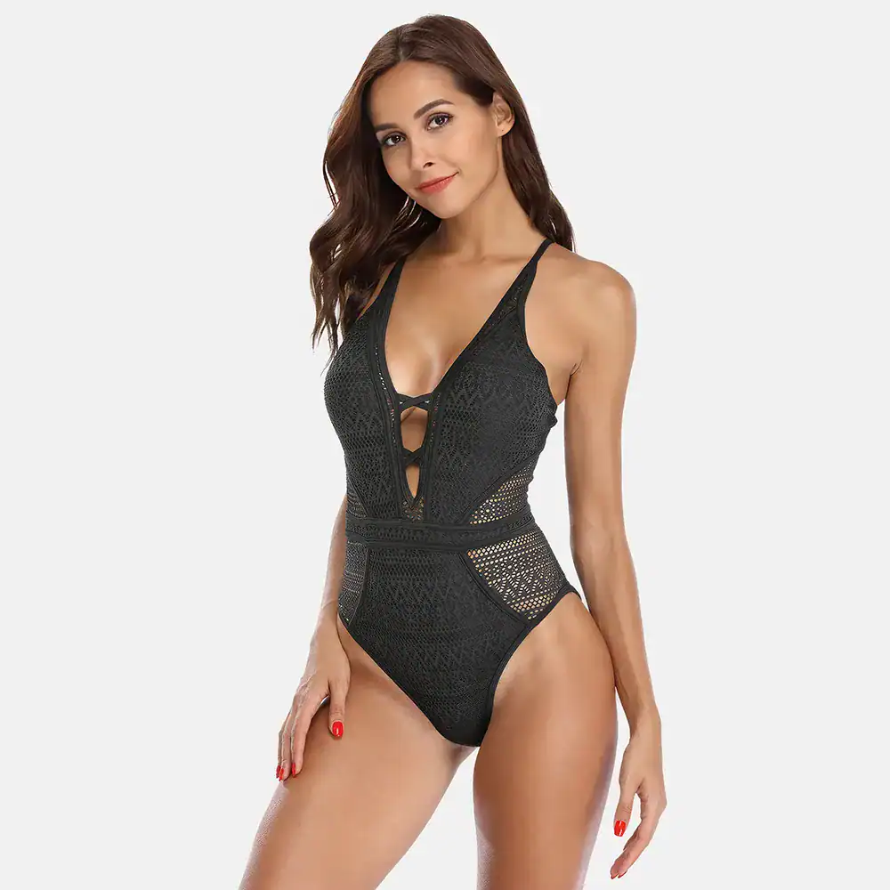 Elegant black lace swimsuit bodysuit with sexy cut-out details, perfect for beach or pool fashion. Features adjustable straps and a flattering fit, ideal for women seeking stylish swimwear options.