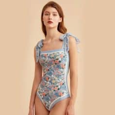 Stunning floral swimsuit featuring bow shoulder details, ideal for stylish swimwear at Monalisa Store or opt for fashionable beachwear.