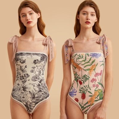 Elegant floral pattern bodysuit ideal for optical fashion, featuring adjustable shoulder ties and a flattering fit. Perfect for modern eyewear stores seeking stylish and comfortable options.