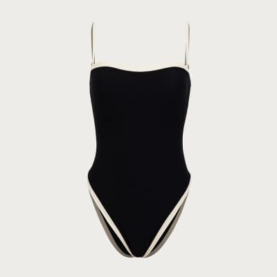 Elegant black and white one-piece swimsuit with stylish design, ideal for beach or poolside fashion, perfect for women seeking trendy swimwear options.
