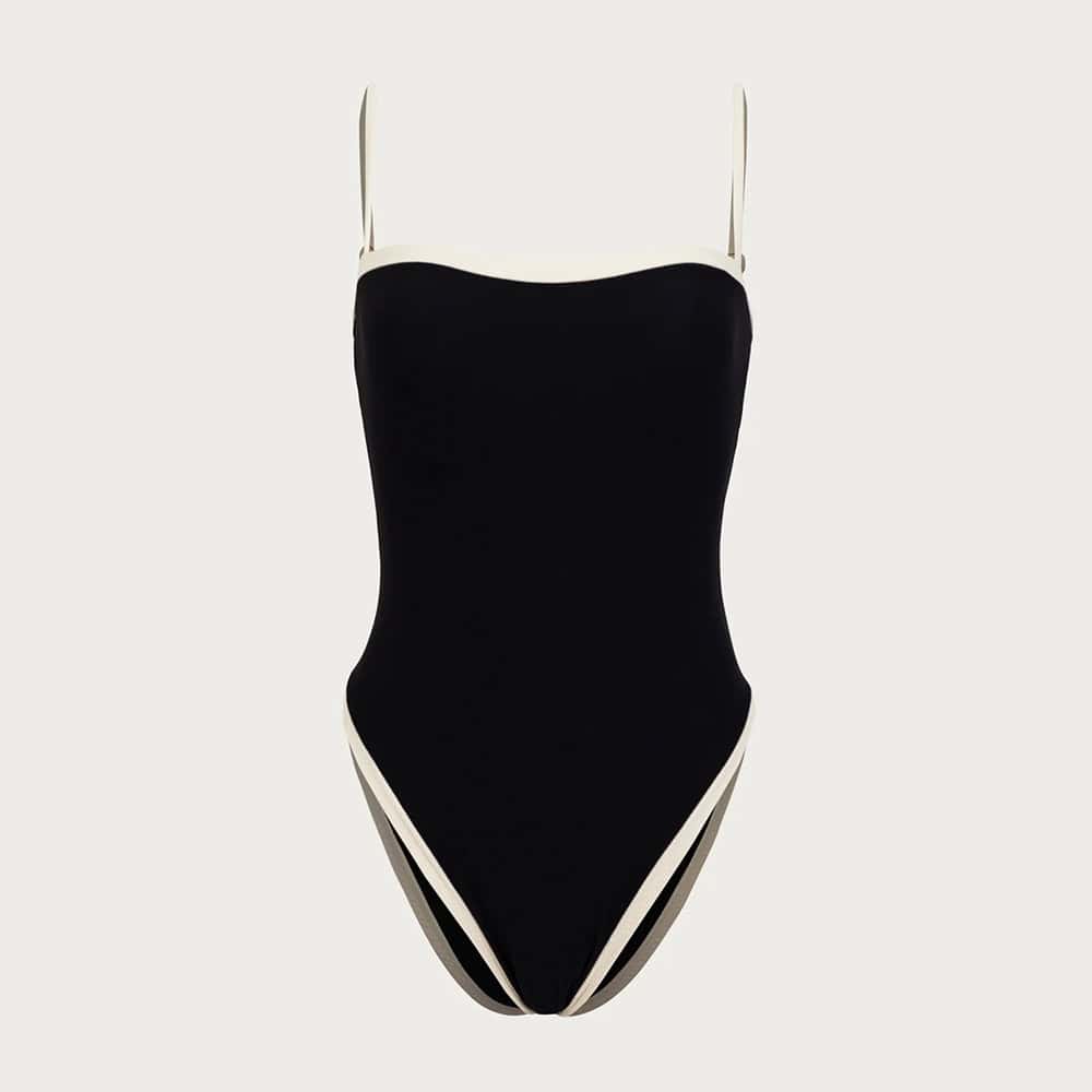 Elegant black and white one-piece swimsuit with stylish design, ideal for beach or poolside fashion, perfect for women seeking trendy swimwear options.