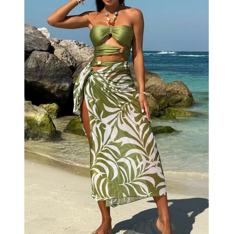 A stylish green tropical beach dress with wrap design, perfect for summer vacations and seaside outings. Lightweight and fashionable, ideal for women seeking comfort and elegance by the ocean.