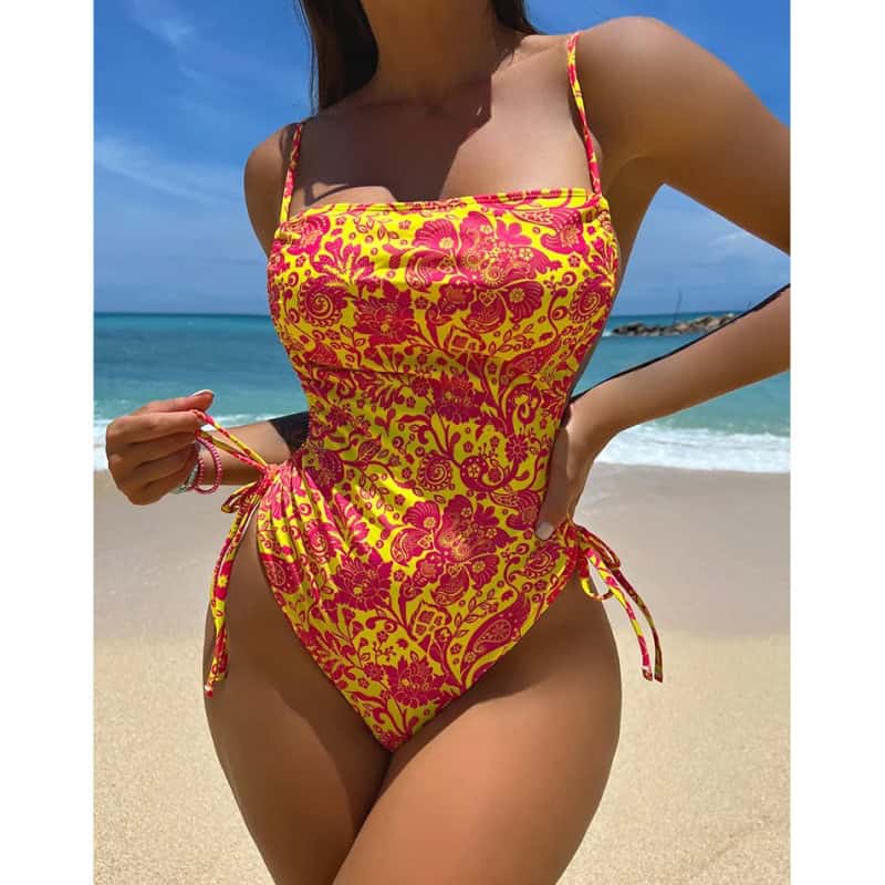 High-quality women's tropical summer one-piece swimsuit with adjustable side ties, perfect for beach, pool, and vacation wear. Comfortable, stylish, and ideal for summer holidays.