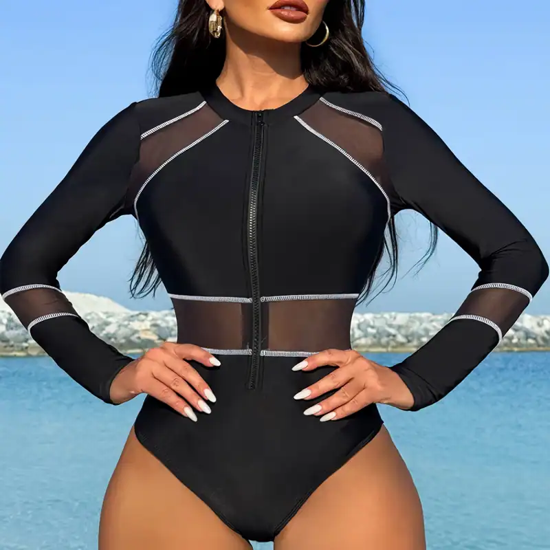 Black mesh swimsuit with zipper featuring sheer panels and contrast stitching, perfect for stylish beachwear or poolside fashion.