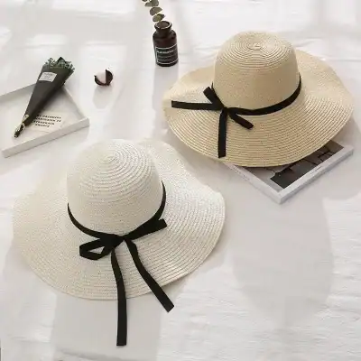Stylish woven sun hats with black satin ribbons, perfect for summer sun protection and fashion. Ideal accessories for beach outings, vacations, or casual outdoor events.