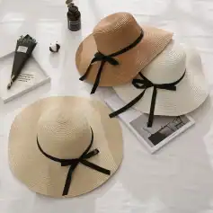 Stylish wide-brim sun hats with black ribbon ties, perfect for summer and outdoor sun protection. Available at Monalisa Store for elegant summer accessories.