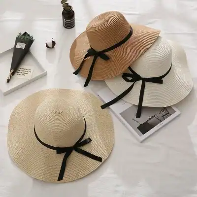 Stylish wide-brim sun hats with black ribbon ties, perfect for summer and outdoor sun protection. Available at Monalisa Store for elegant summer accessories.