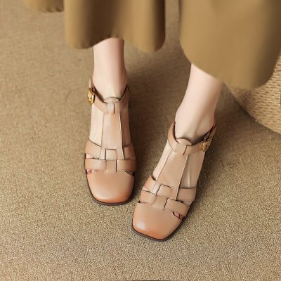 Comfortable women's beige T-strap sandals with block heels, perfect for stylish and casual wear. Made from high-quality materials, these sandals offer both fashion and comfort.