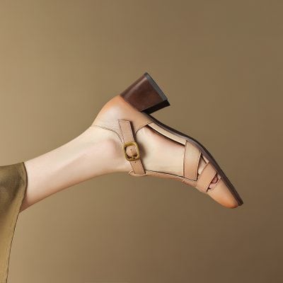 Elegant tan women's heeled sandal with ankle strap and buckle detail, perfect for stylish occasions and comfort.
