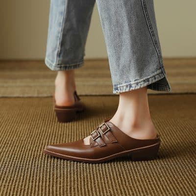 Comfortable women's ballet flats with double buckles in brown leather, perfect for casual or office wear, offering elegance and all-day comfort.