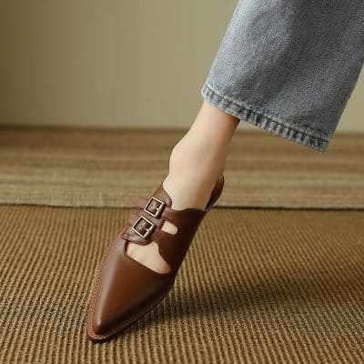 Stylish brown pointed toe shoe featuring double buckle straps, perfect for fashionable women, ideal for office or casual wear.