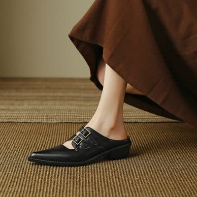 Stylish black women's loafers with buckle detail, ideal for office and casual wear, providing comfort and fashion for all-day use.