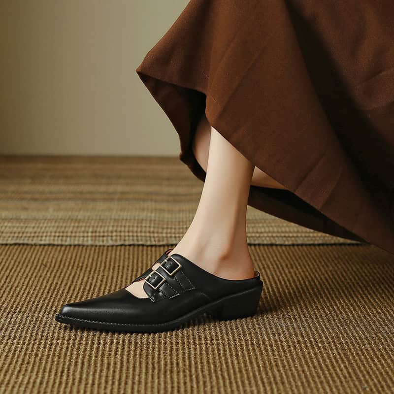 Stylish black women's loafers with buckle detail, ideal for office and casual wear, providing comfort and fashion for all-day use.