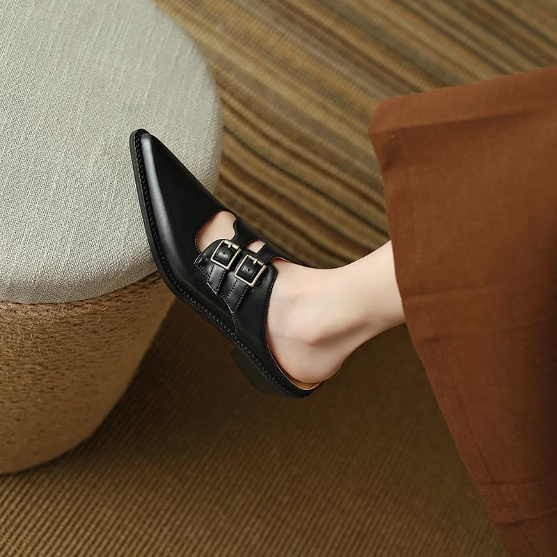 Elegant black leather shoes with double buckle straps, perfect for formal or casual wear, available at Monalisa Store. Comfortable and fashionable footwear for every occasion.