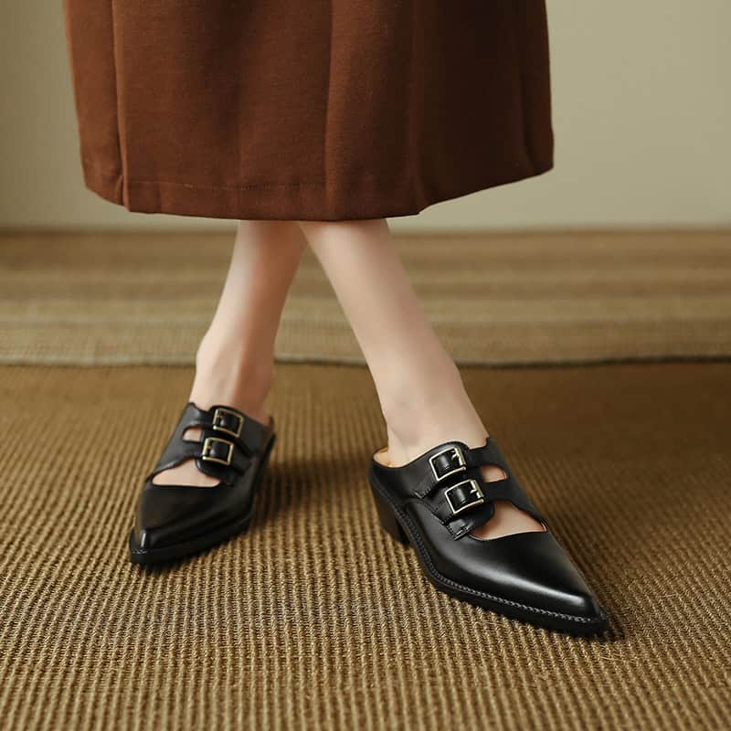 Elegant black buckle shoes for women, perfect for fashion and comfort, ideal for office or casual wear. Slip-ons with pointed toes and sleek design.