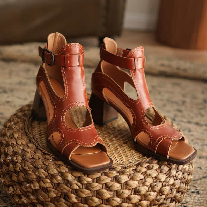 Elegant brown leather open-toe high-heel sandals with ankle straps, perfect for fashion-forward outings. Crafted for style and comfort, these women's shoes are ideal for trendy wardrobes.