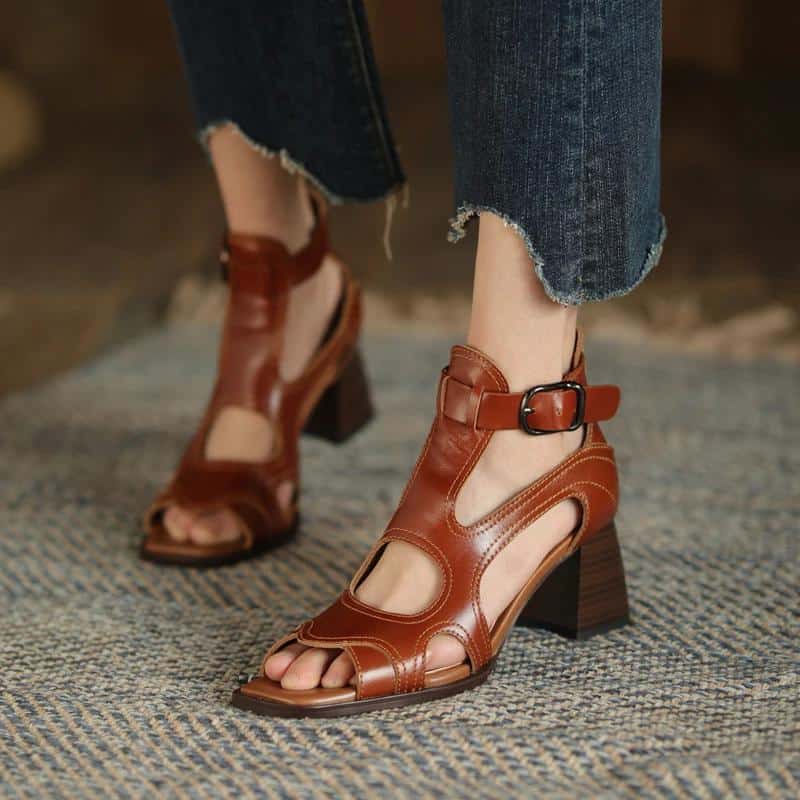 High-quality brown leather open-toe sandals with a buckle strap, stylish design suitable for fashion-forward women. Perfect for casual and dressy occasions.