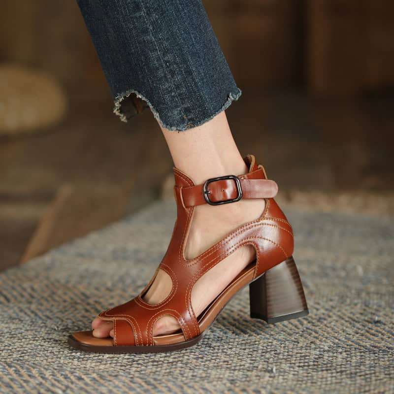 Elegant brown leather high-heel sandals with ankle strap and buckle, perfect for stylish occasions and optometry fashion statements.