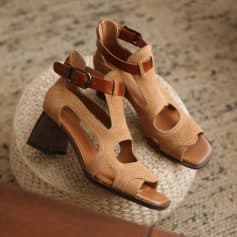 Stylish open-toe women’s sandals featuring a trendy buckle strap and high heel, perfect for summer outings, casual wear, and fashion-forward footwear.