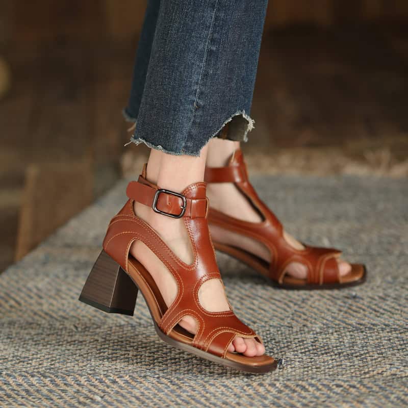 Stylish women's tan leather sandals with ankle strap, high heel, and open toe—ideal for summer and casual chic looks.